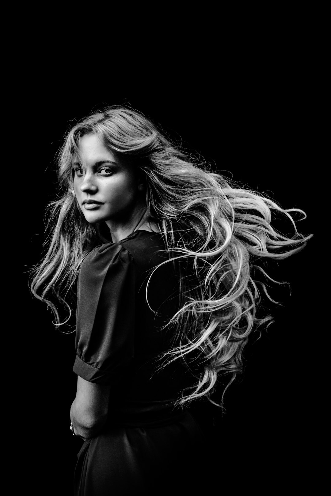 Elegant Dutch singer in a silk blouse studio portrait