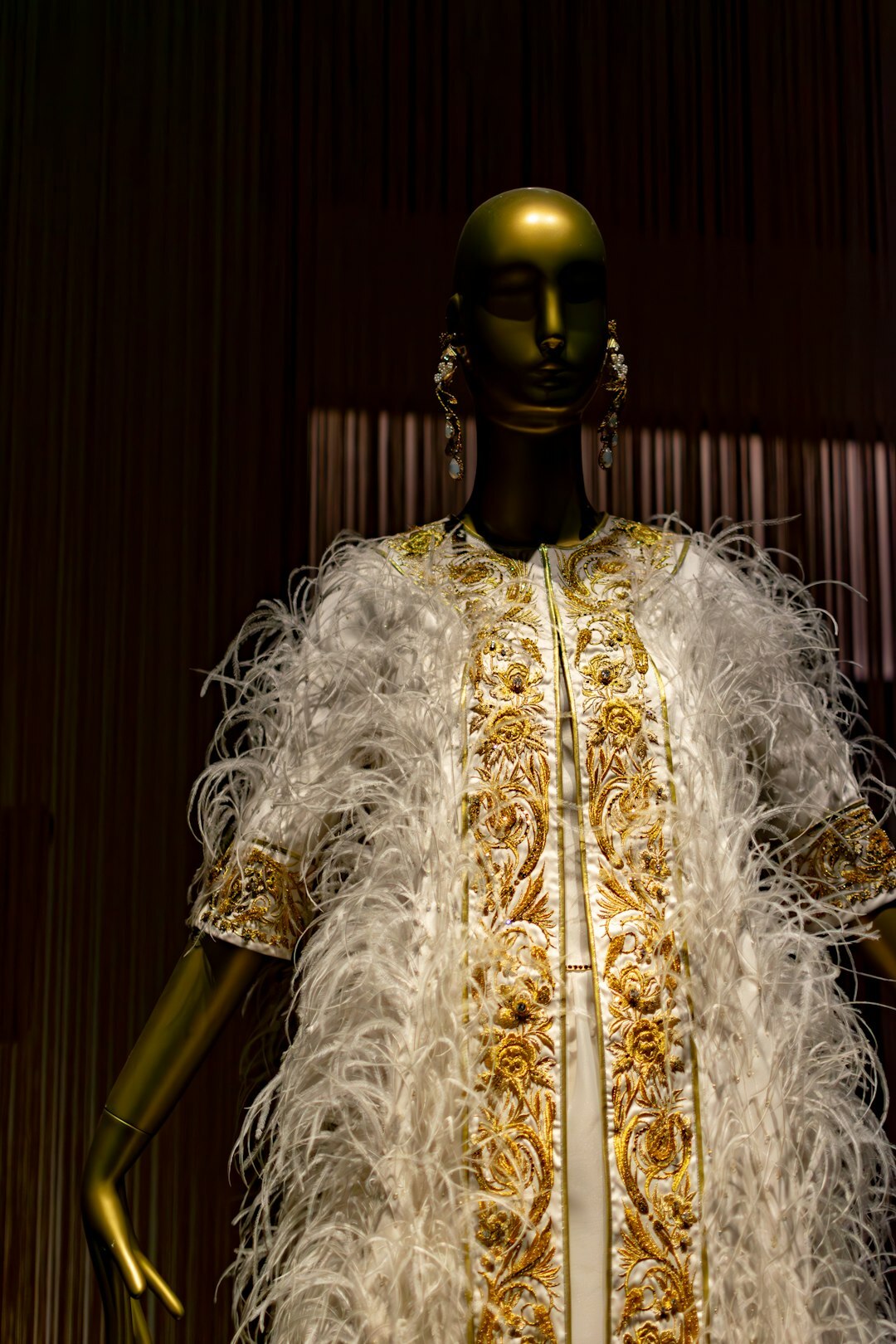 Curated rack of vintage haute couture garments in a fashion atelier