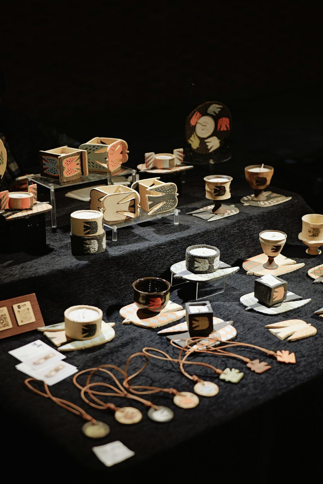 Vintage film reels and archival photographs laid out on a wooden table